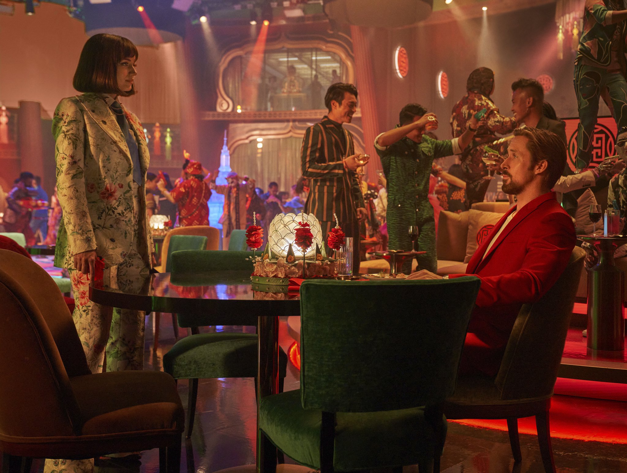 Ana de Armas and Ryan Gosling in a scene set in a nightclub from The Gray Man